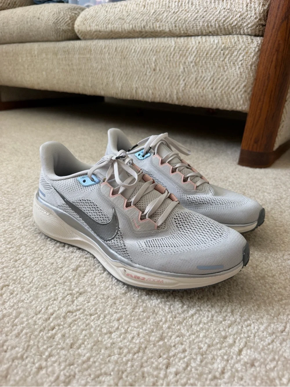 Nike Women’s Light Gray Running Shoes with Pink and Blue Accents